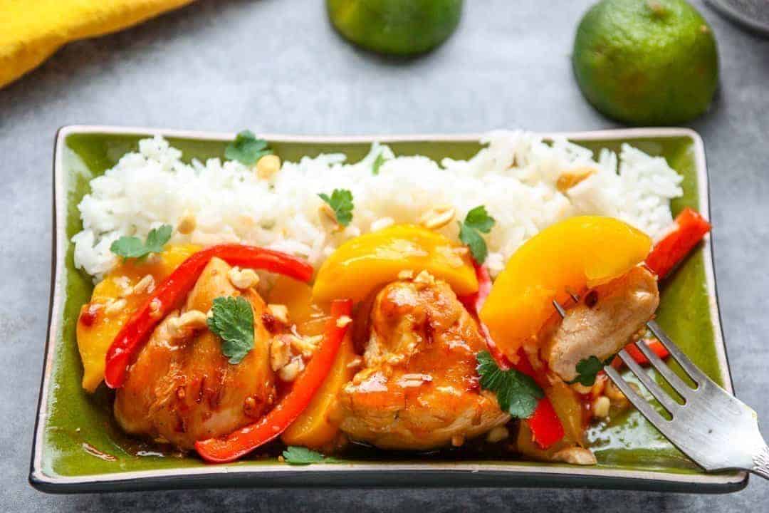 A plate of food on a table, with Peach and Chicken